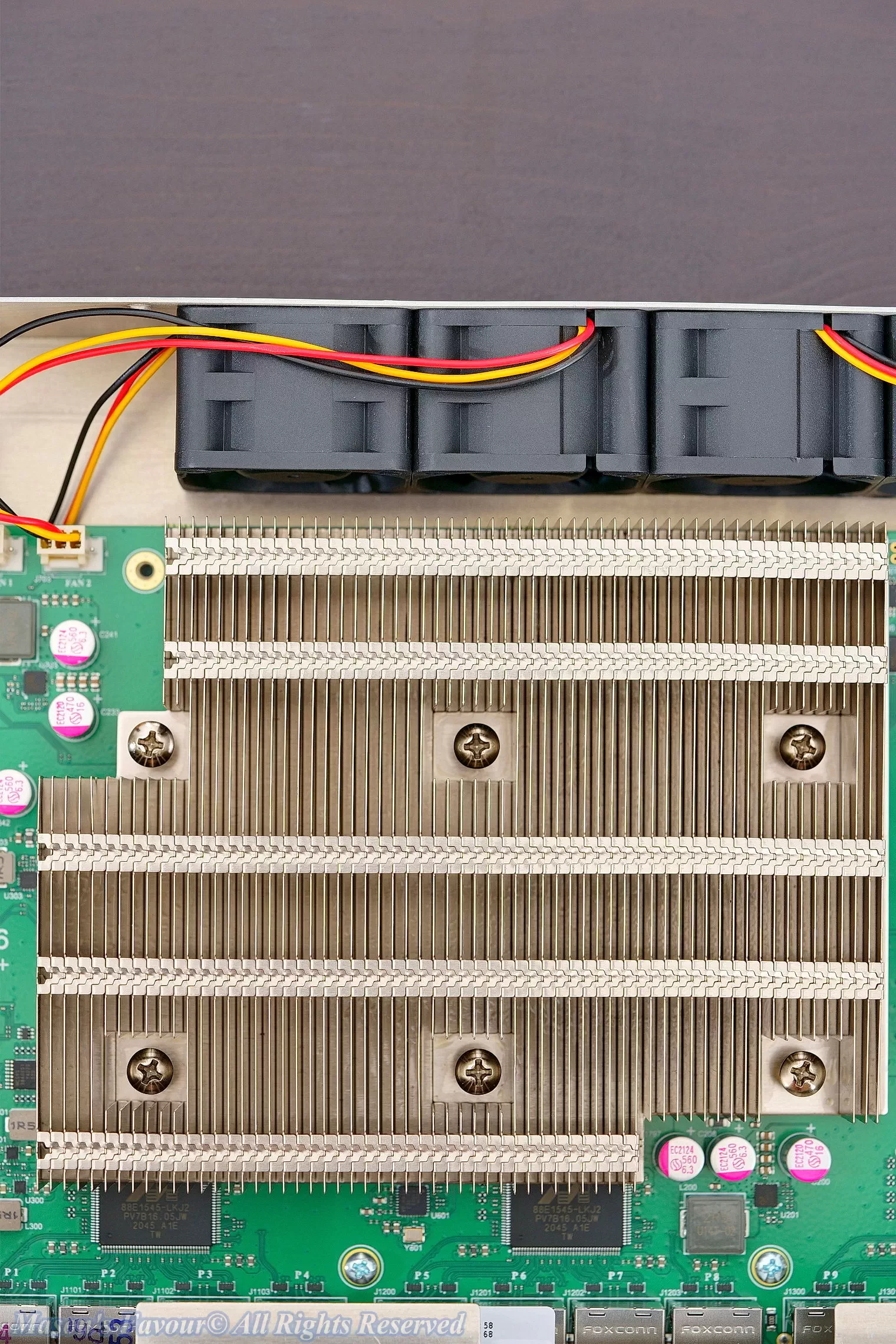 MikroTik CCR2116, Teardown, Heatsink with Screws, Capacitors, and Fans, Top