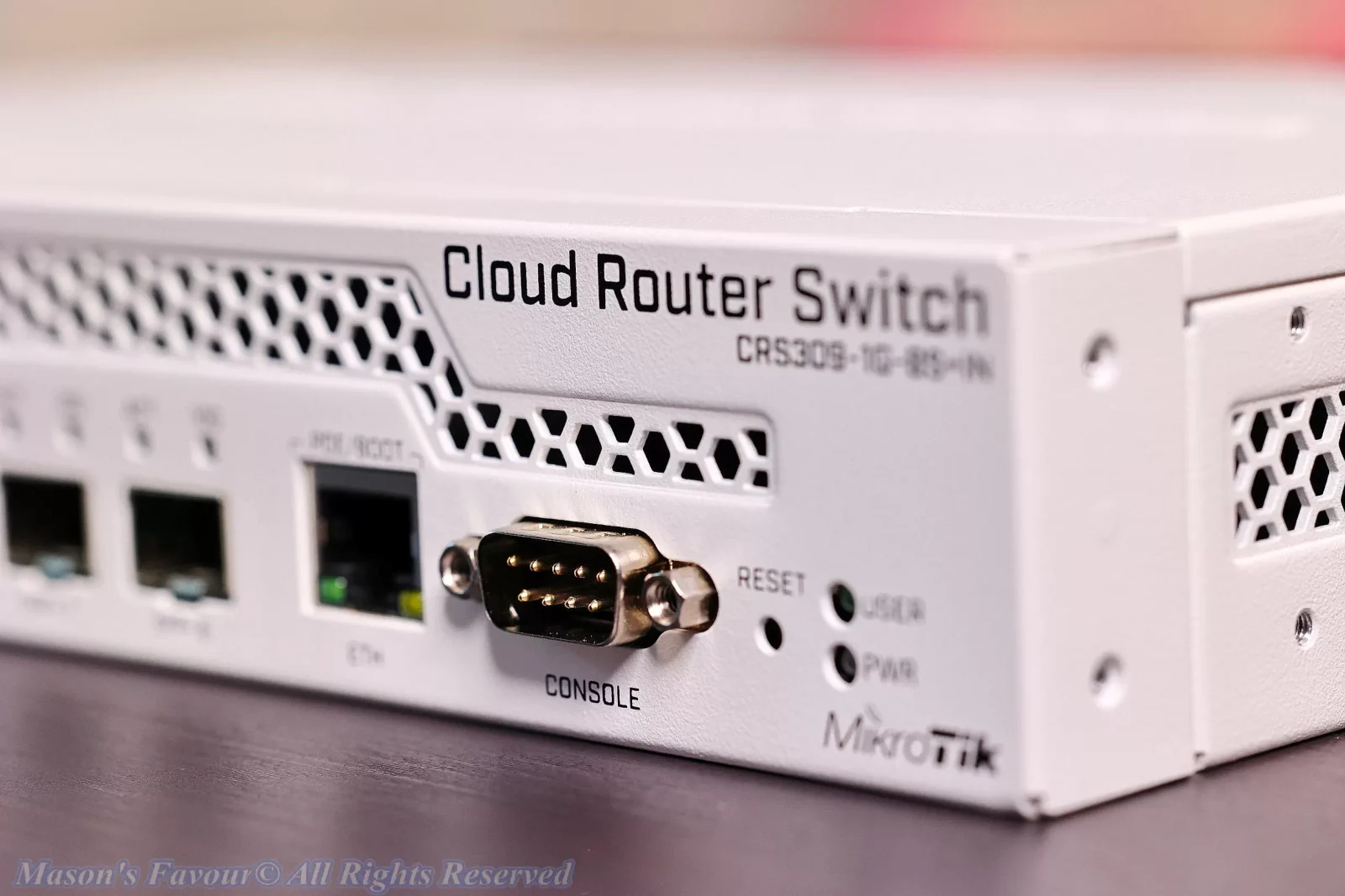 MikroTik CRS309-1G-8S+IN - Enlarged View, Console Port, LOGO